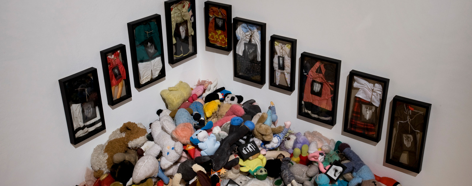 Installation Images from Annette Messager: The Messengers Exhibition at The Hayward 2009 Stuffed Toys and Clothes in Frames by artist, Annette Messager at Hayward Gallery